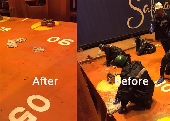 Before and after: crew scrubbing an orange hatch cover by hand, which is left clean