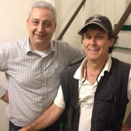 Billy Brown with a crew member at a stairway on board