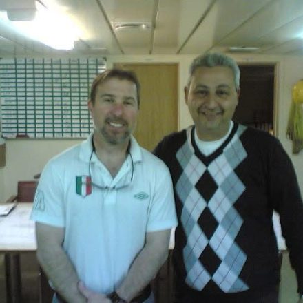 Billy Brown with an officer in the ship's office