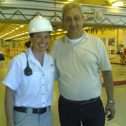 Billy Brown with an officer in a hard hat on the vehicle deck
