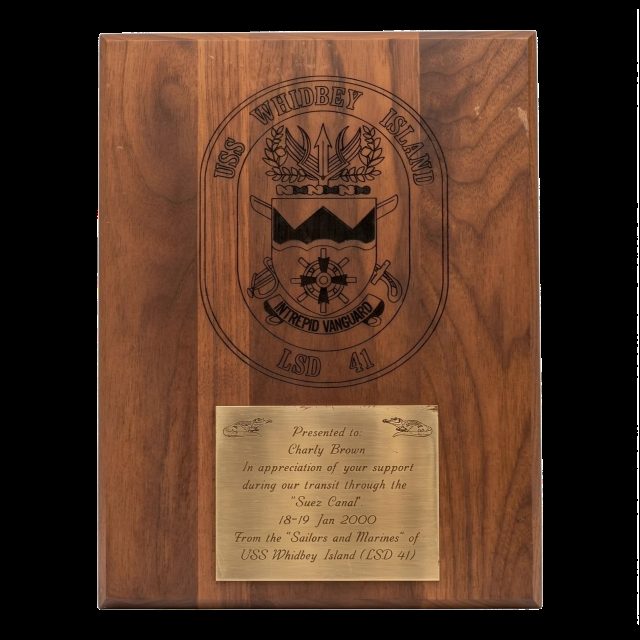 Wooden plaque of USS Whidbey Island, LSD 41, presented to Charly Brown in appreciation of support during the Suez Canal transit, 18 to 19 January 2000