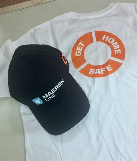 White Get Home Safe T-shirt with a black Maersk Line cap